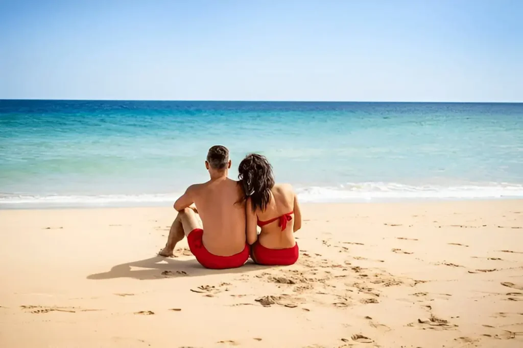 Beautiful couple watching blue sea,Less Touristy Beach Towns in Spain