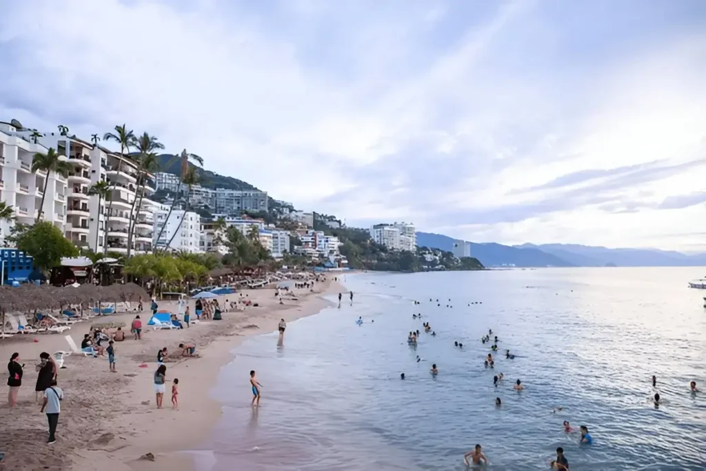 amily enjoying a beautiful sunset from the beach in Puerto Vallarta. Best Places to Visit in Mexico with Family
