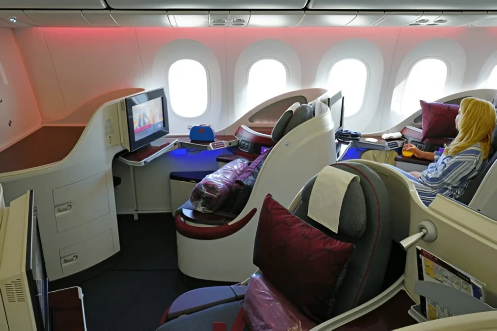 Is Qatar Airways a Good Airline for Your Next Trip? View of Business Class seats on a Qatar Airways (QR) Boeing 787 Dreamliner airplane