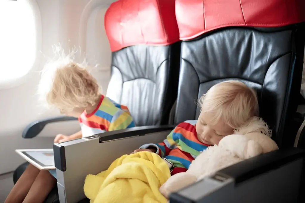 Traveling with young children. Child in airplane. Best Way to Travel with a Baby on a Plane